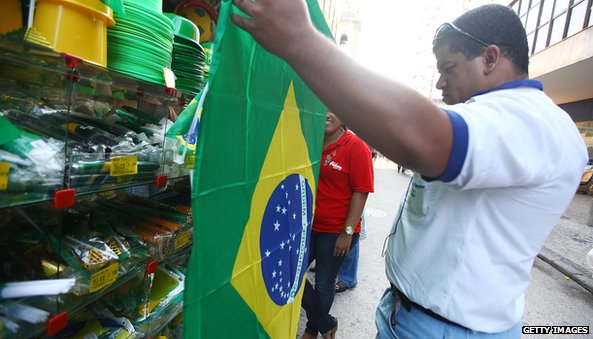 Man holding Brazilian flag
