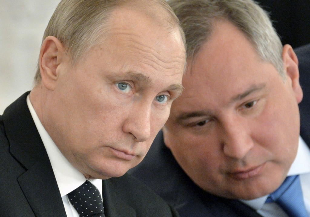 In this March 17, 2015 file photo, Russian President Vladimir Putin, left, and Deputy Prime Minister Dmitry Rogozin attend a meeting of the Victory Day celebrations organizing committee in the Kremlin in Moscow, Russia. Back-to-back rocket launch failures have dealt Russia one of the heaviest blows to its space industry since the Soviet collapse _ with national pride and billions of dollars at stake. The setbacks threaten to erode Russia’s leading position in the multibillion global launch market, in which it commands an estimated 40 percent share, and dent Putin’s efforts to boost the country’s global prestige. The competition for lucrative commercial satellite contracts is intensifying, with American, European, Chinese and Indian companies all eager to expand their share. Rogozin warned this week that Russia could soon lose its chunk if the problems aren’t fixed quickly. (Alexei Druzhinin/RIA Novosti, Kremlin Pool Photo via AP, File) (picture from washingtonpost)