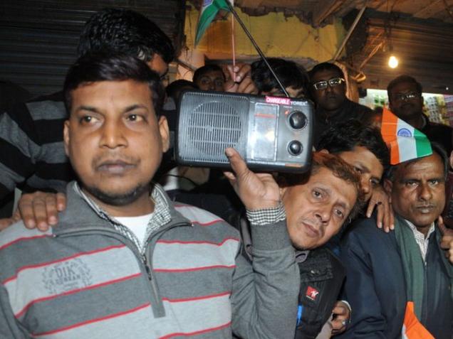 File photo of people listening to Prime Minister Narendra Modi's Mann Ki Baat programme in radio.