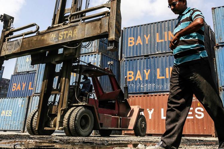A freight depot near a port in India, where the central bank cut rates on Tuesday, citing some weakness. PHOTO: DHIRAJ SINGH/BLOOMBERG NEWS