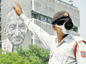 MASKED LAWMAN: A traffic cop at Delhi's ITO on Thursday. (TOi photo by Sanjeev Rastogi)