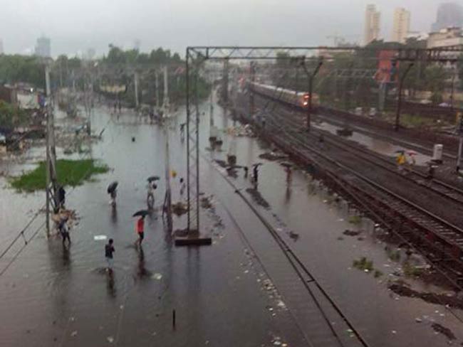 Heavy rain in Mumbai has badly hit traffic and train services