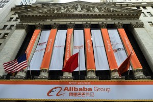 The New York Stock Exchange building is seen adroned with banners on September 19, 2014. A buying frenzy sent Alibaba shares sharply higher Friday as the Chinese online giant made its historic Wall Street trading debut. In early trades after the record public share offering, Alibaba leapt from an opening price of $68 to nearly $100 and, while it dropped back, was still up some 38 percent at $94.08 after 10 minutes. AFP PHOTO/Jewel Samad