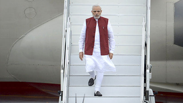 Prime Minister Narendra Modi disembarks a plane upon his arrival before attending the BRICS and the Shanghai Cooperation Organization (SCO) summits in Ufa, Russia. (Reuters)