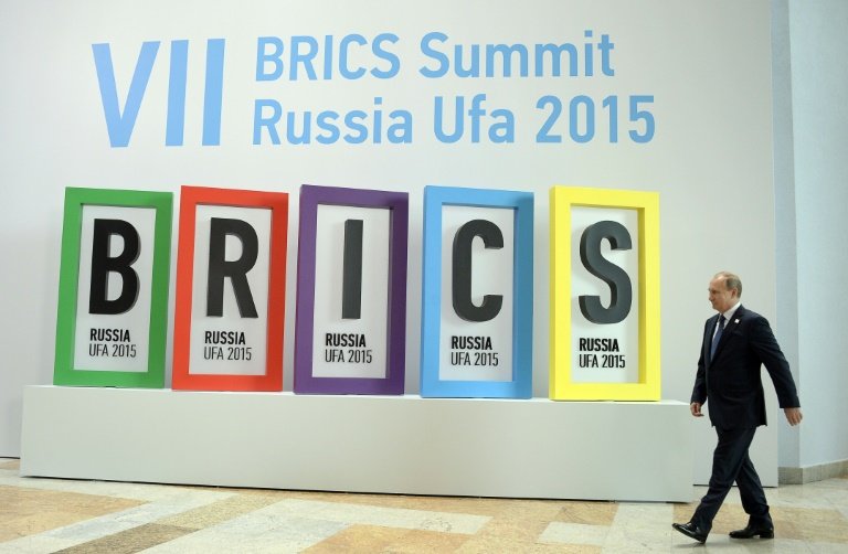 The bank's opening comes two weeks after a BRICS summit hosted by Russian President Vladimir Putin. Read more: http://www.businessinsider.com/afp-new-brics-bank-opens-for-business-in-china-xinhua-2015-7#ixzz3gg5mtNVf