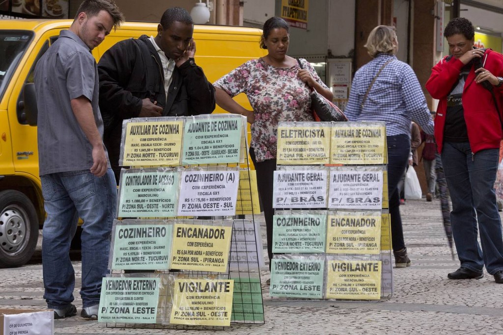 People look at job postings in downtown Sao Paulo, Brazil on Tuesday. PHOTO: ANDRE PENNER/ASSOCIATED PRESS