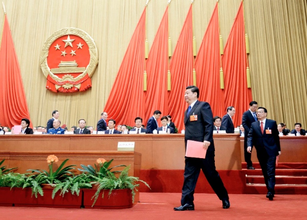 File Photo: Xi Jinping and Li Keqiang walk to cast their votes at the fifth plenary meeting of the first session of the 12th National People’s Congress (NPC) at the Great Hall of the People in Beijing, capital of China, March 15, 2013 [Xinhua]