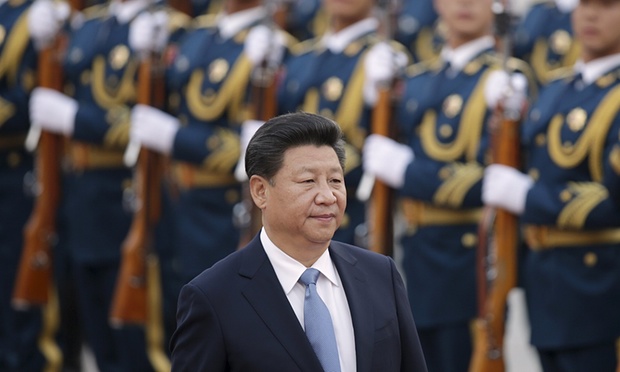 Xi Jinping inspects honour guards during a ceremony in Beijing. His trip to Britain will be his first as president. Photograph: Jason Lee/Reuters