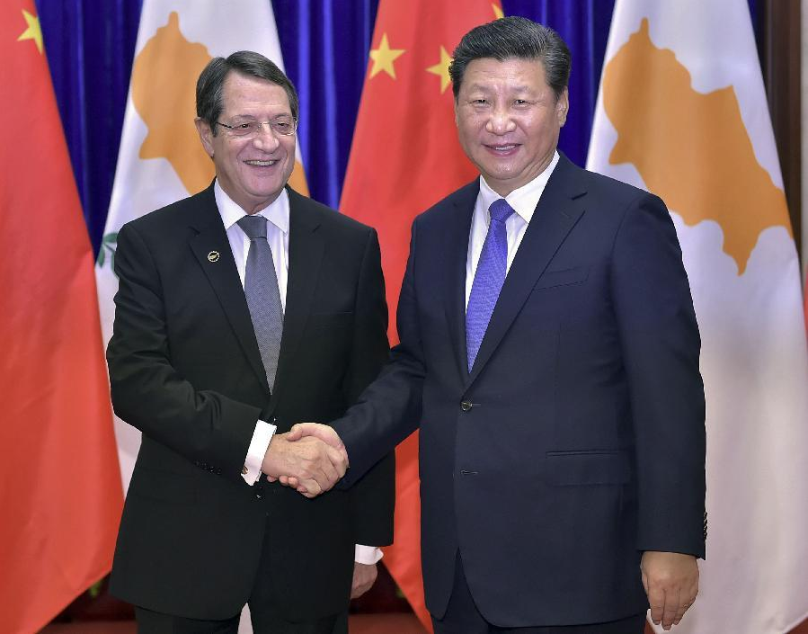 Chinese PresidentXi Jinping shakes hands with Cypriot President Nicos Anastasiades at the Great Hall of the People in Beijing, China. © Xinhua