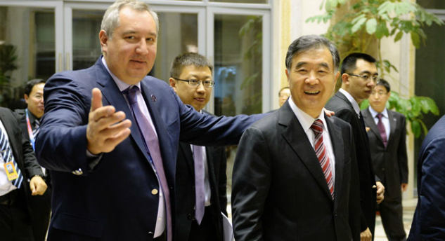 Russian Deputy Prime Minister Dmitry Rogozin, left, and Chinese Vice Premier Wang Yang before a joint dinner. RIA Novsti/Sergei Mamontov