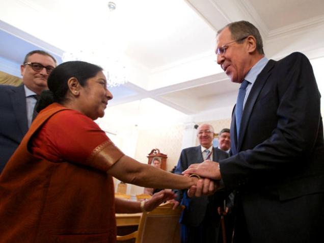 Russian Foreign Minister Sergey Lavrov, right, and India's External Affairs Minister Sushma Swaraj shake hands during their meeting in Moscow, Russia, Tuesday