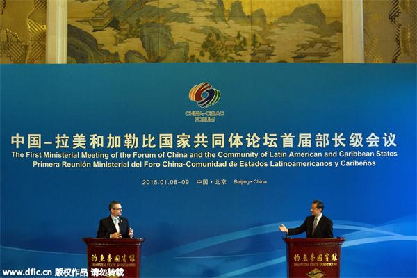 Chinese Foreign Minister Wang Yi, right, acknowledges Costa Rica's Foreign Minister Manuel Gonzalez during a press conference at the Diaoyutai State guesthouse after a two-day meeting between China and Latin American and Caribbean countries in Beijing, Friday, Jan. 9, 2015. © IC