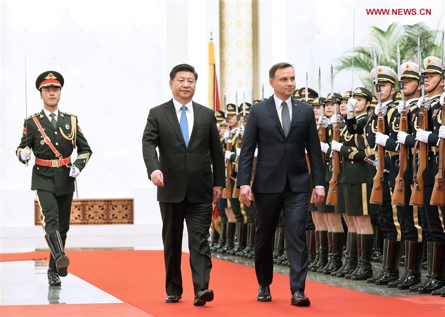 Chinese President Xi Jinping (L, front) and Polish President Andrzej Duda (R, front) review an honor guard during a welcome ceremony before their talks at the Great Hall of the People in Beijing, capital of China, Nov. 25, 2015. (Xinhua/Pang Xinglei)