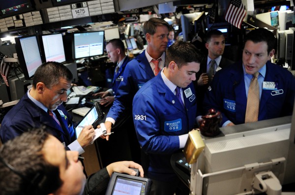 Global investors are relieved that an imminent US rate hike on the back of an improving economy will likely be slow-paced © Xinhua
