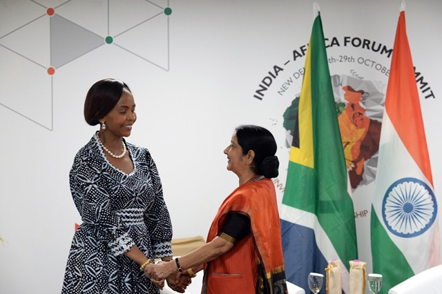 South African Foreign Minister Maite Nkoana-Mashabane (L) shakes hands with Indian Foreign Minister Sushma Swaraj (R) during The India-Africa Summit in New Delhi on October 27, 2015. AFP PHOTO / PRAKASH SINGH