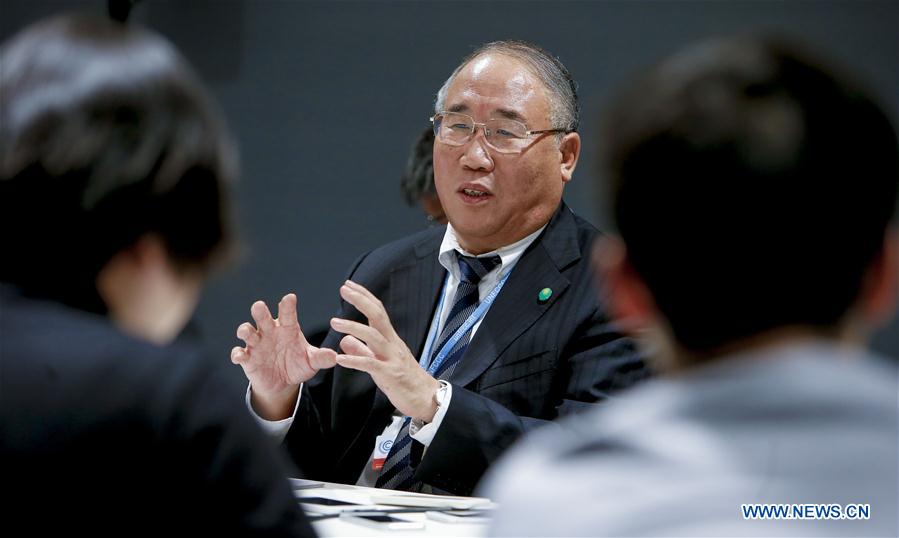 China's Special Envoy on Climate Change Xie Zhenhua speaks to media at the venue of Paris Climate Change Conference at Le Bourget on the northern suburbs of Paris, France, Dec. 9, 2015. French Foreign Minister and President of Paris Climate Conference Laurent Fabius presented a new clean version of text for a global climate agreement on Wednesday as a basis for further negotiations among countries in the next 48 hours. The main outstanding issues that remain to be resolved include post-2020 climate finance, ambition of action and how to reflect the principle of "common but differentiated responsibility" in all elements of the new agreement. © Xinhua/Zhou Lei