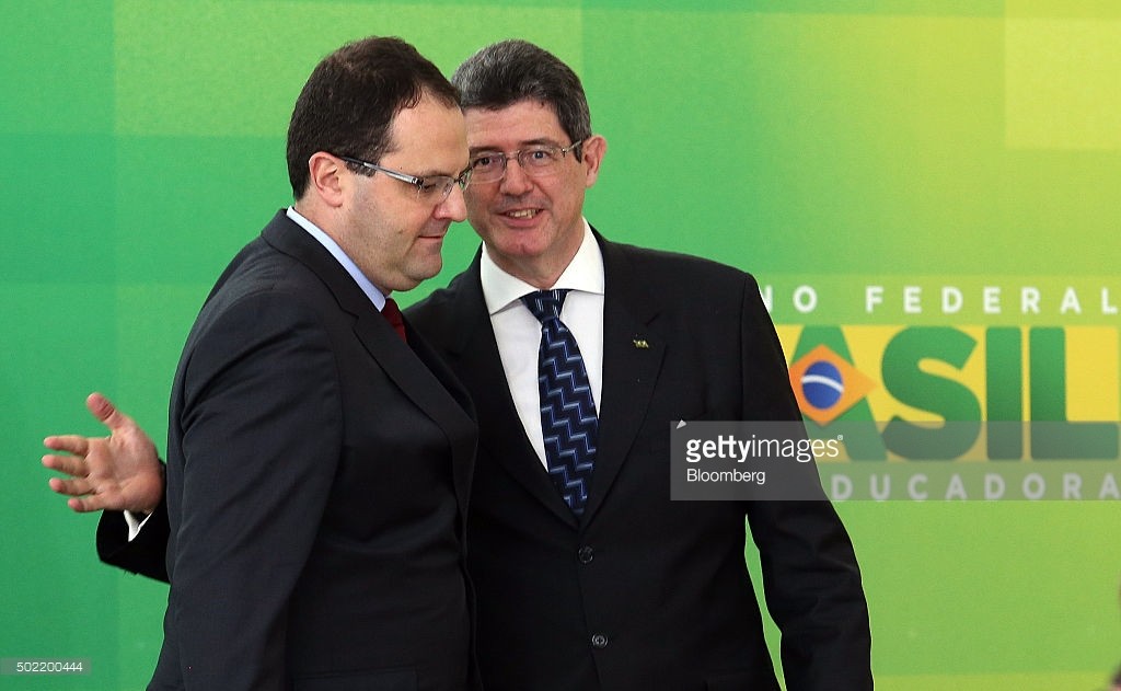 Nelson Barbosa, Brazil's new finance minister, left, is congratulated during his inauguration by former finance minister Joaquim Levy in Brasilia, Brazil, on Monday, Dec. 21, 2015. Financial markets sank for a second session on Monday after news spread that Barbosa would be the countrys next finance minister, replacing the beleaguered Levy. Photographer: Lula Marques/Bloomberg 