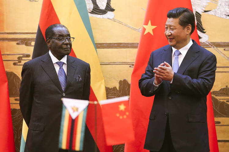 Chinese President Xi Jinping, right, is the first Chinese president to visit Zimbabwe since 1996. He is seen likely to try to glean some insight into who will succeed 91-year-old Zimbabwean President Robert Mugabe, left. Photo: Associated Press