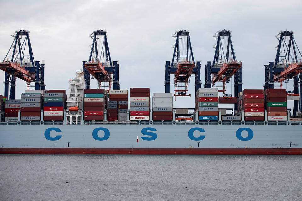 A container ship operated by Cosco Group sits docked as ship-to-shore cranes stand at the Euromax Terminal in the Port of Rotterdam in the Netherlands. Photo: Bloomberg News