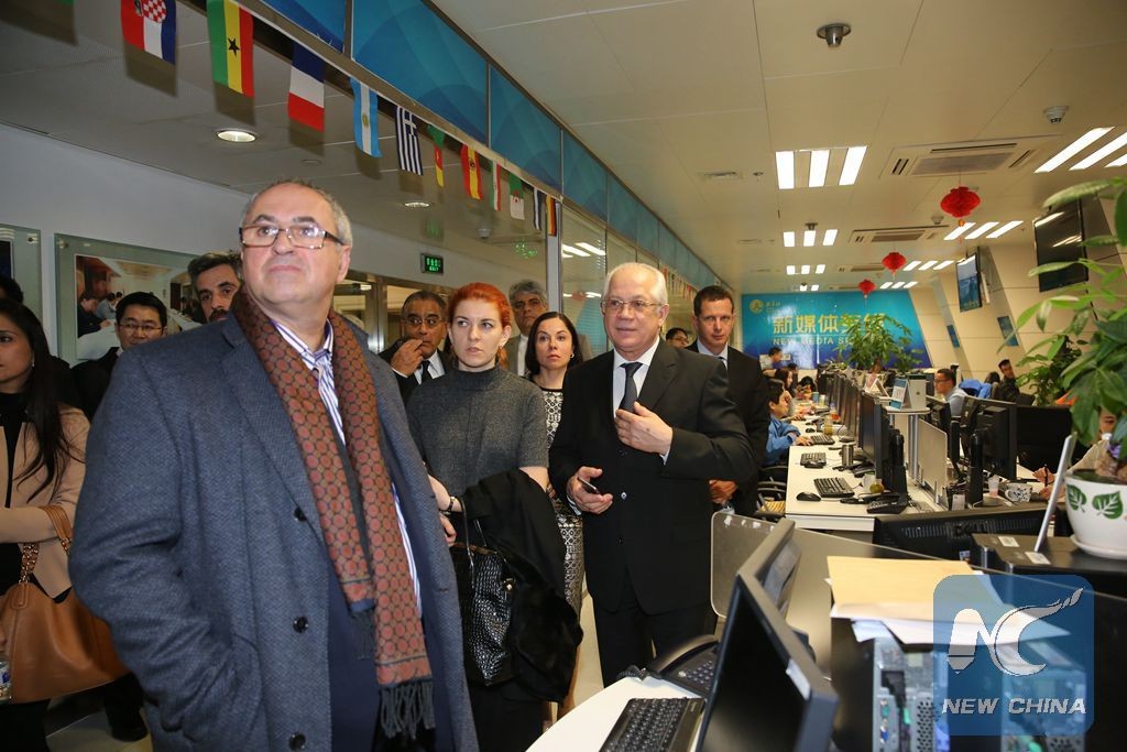 Guests attending the first BRICS media summit visit Xinhua News Agency in Beijing, capital of China, Nov. 30, 2015. A BRICS media summit will begin in Beijing on Dec. 1, focusing on cooperation between BRICS media organizations. Leaders of 25 media groups from Brazil, Russia, India, China and South Africa will attend the meeting, which will be hosted by Xinhua. © Xinhua/Yin Gang)