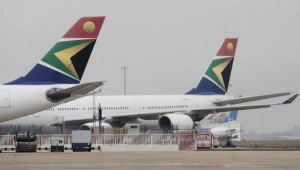 (FILES) -- A file picture taken on February 17, 2009, shows South African Airways planes parked at Heathrow airport in London. South Africa's struggling national carrier awaits news on a state cash injection vital to stay in the skies, but which shows up its inability to make money. Eighty years after its creation, loss-making South African Airways (SAA) battles with an ageing fleet and a weak national currency. AFP PHOTO/Ben Stansall
