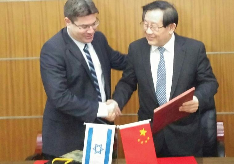 SCIENCE MINISTER Ophir Akunis shakes hands with his Chinese counterpart, Wan Gang, in Beijing on Dec 14th 2015. (photo credit:Courtesy)