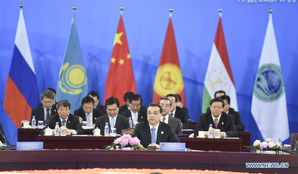 Chinese Premier Li Keqiang (Front) presides over the 14th prime ministers' meeting of the Shanghai Cooperation Organization (SCO) in Zhengzhou, capital of central China's Henan province, Dec 15, 2015. © Xinhua