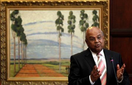 South Africa's Finance Minister Pravin Gordhan gestures during a media briefing to announce a new deputy governor of the central bank in Pretoria March 25, 2011. South African National Treasury Director General Lesetja Kganyago is to leave his position to become a deputy governor of the central bank from May 16, South African President Jacob Zuma said on Friday. REUTERS/Siphiwe Sibeko (SOUTH AFRICA - Tags: POLITICS BUSINESS) - RTR2KE94