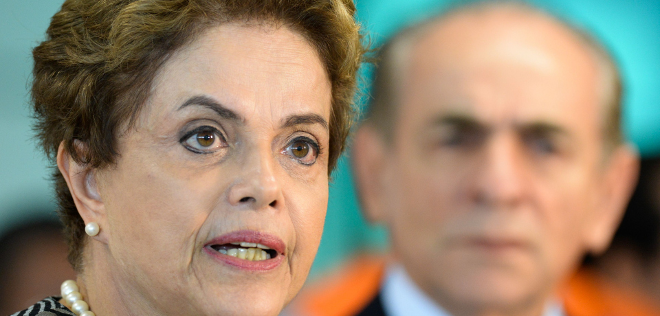 Brazil's President Dilma Rousseff speaks to journalists next to Health minister Marcelo Castro after visiting the National Center for Coordination and Control of Aedes aegypti mosquito, in Brasilia, Brazil on January 29, 2016. AFP PHOTO / ANDRESSA ANHOLETE / AFP / Andressa Anholete (Photo credit should read ANDRESSA ANHOLETE/AFP/Getty Images)