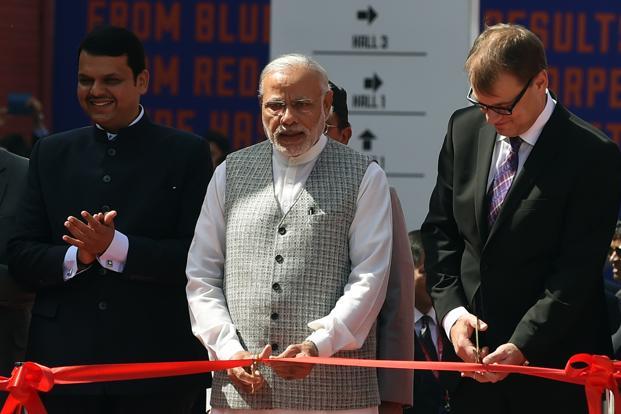 Prime Minister Narendra Modi (centre) cuts a ribbon as Finnish Prime Minister Juha Sipila (right) and Maharashtra chief minister Devendra Fadanvis look on during the opening of the ‘Make in India Week’ in Mumbai. Photo: AFP