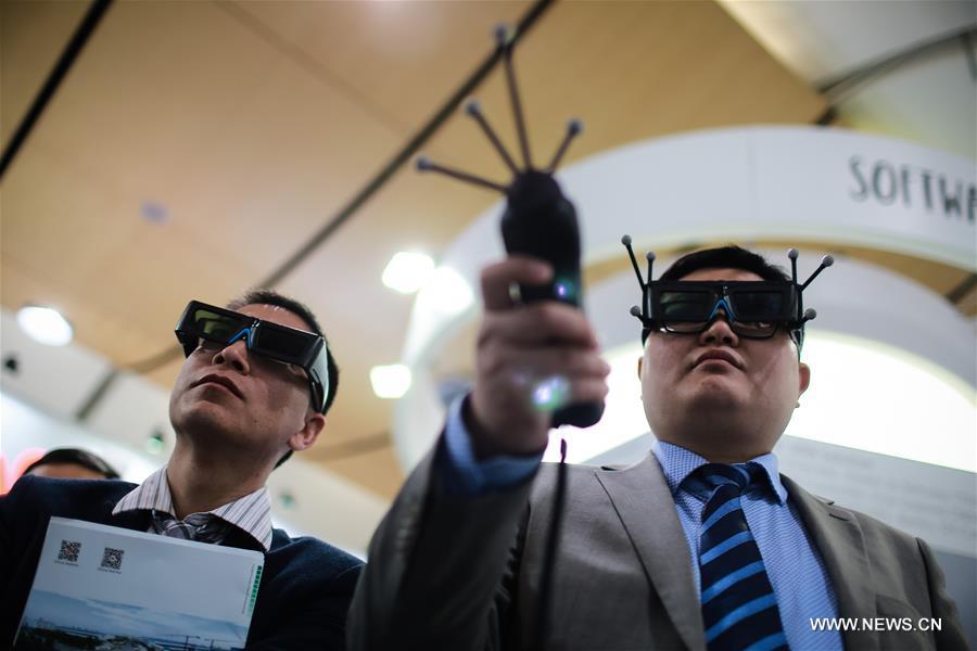 Fair-goers try virtual reality glasses at Huawei's stand of the Hanover Fair in 2016 in Hanover, Germany, on April 26, 2016. Some 700 exhibitors from China, the second only to the host country in terms of the number of exhibitors, attended the fair. (Xinhua/Zhang Fan)