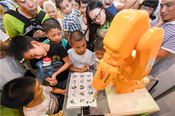 A robot demonstrates precision by writing Chinese calligraphy in Hefei. Photo: Xinhua