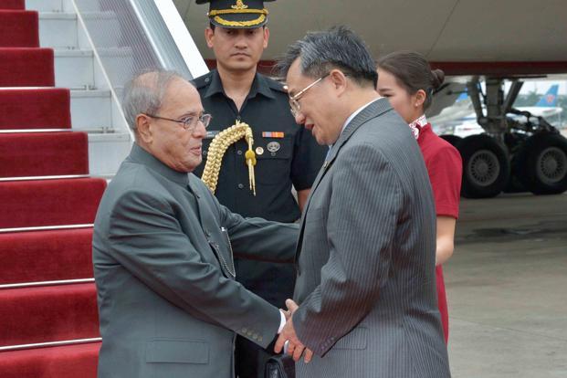 President Pranab Mukherjee was received by China’s foreign affairs vice minister Liu Zhenmin upon his arrival at Guangzhou in China on Tuesday. Photo: PTI