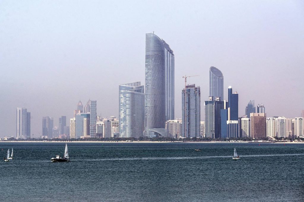 The city skyline beside a waterway in Abu Dhabi. Fitch said this year that the Abu Dhabi government may tap Abu Dhabi Investment Authority funds to overcome its deficit. PHOTO: BLOOMBERG NEWS