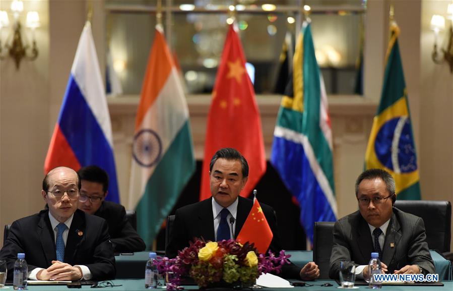 Chinese Foreign Minister Wang Yi (C) addresses a meeting of foreign ministers from the BRICS nations on the sidelines of a series of UN conferences in New York, the United States, on Sept. 20, 2016. Chinese Foreign Minister Wang Yi on Tuesday urged the BRICS nations to preserve world peace and help promote global growth. (Xinhua/Yin Bogu)